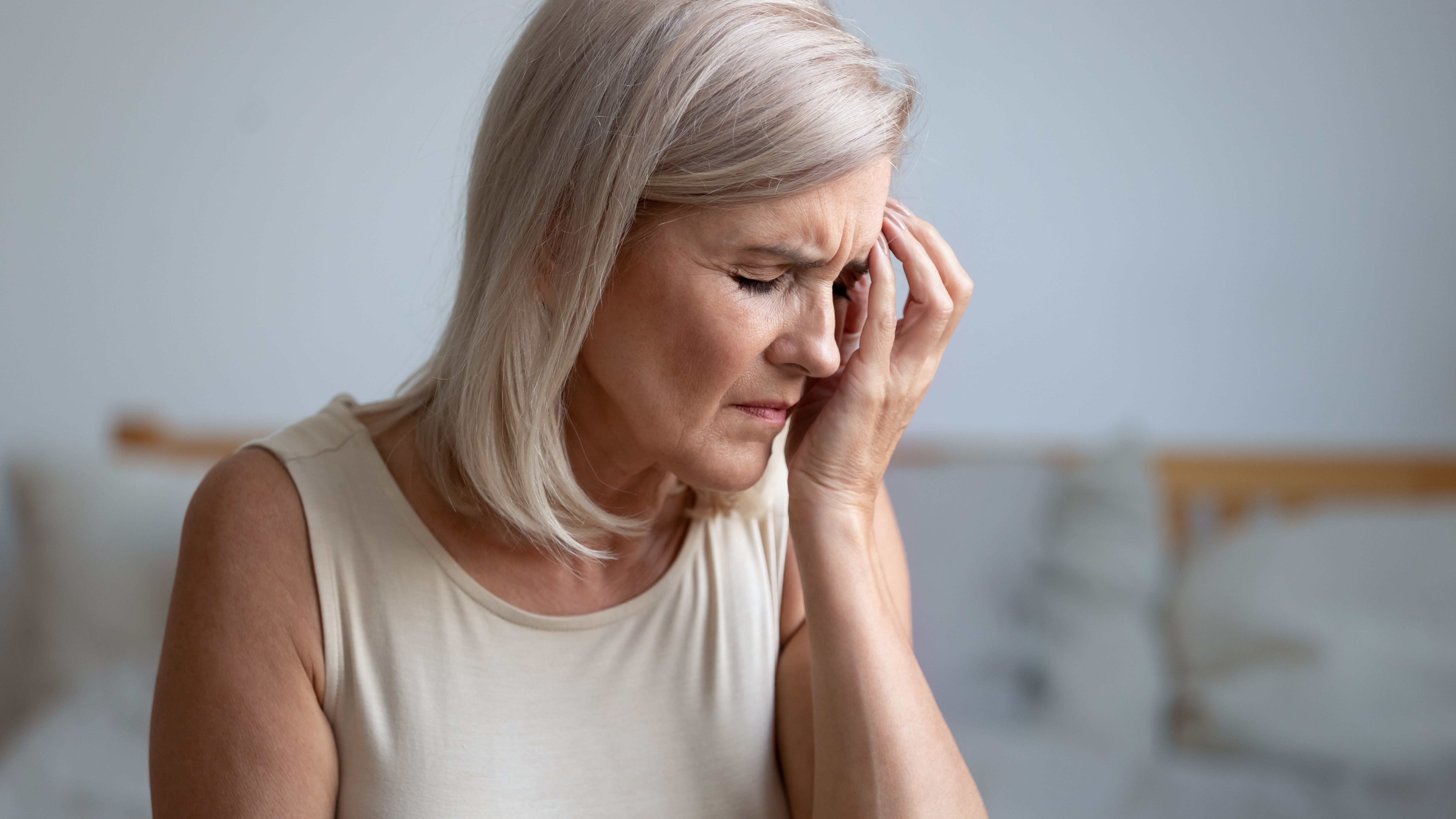 Woman suffering from headache pain