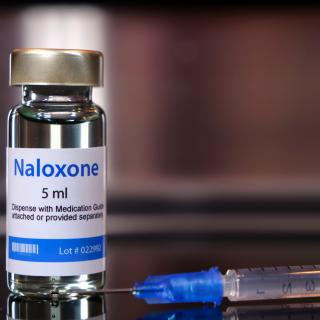 Vial of naloxone with syringe