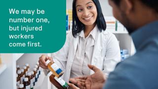 Pharmacist looking at prescriptions with patient